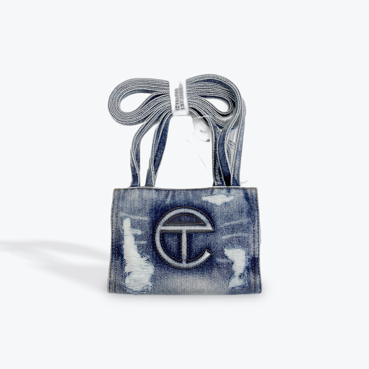Telfar blue distress denim bag small